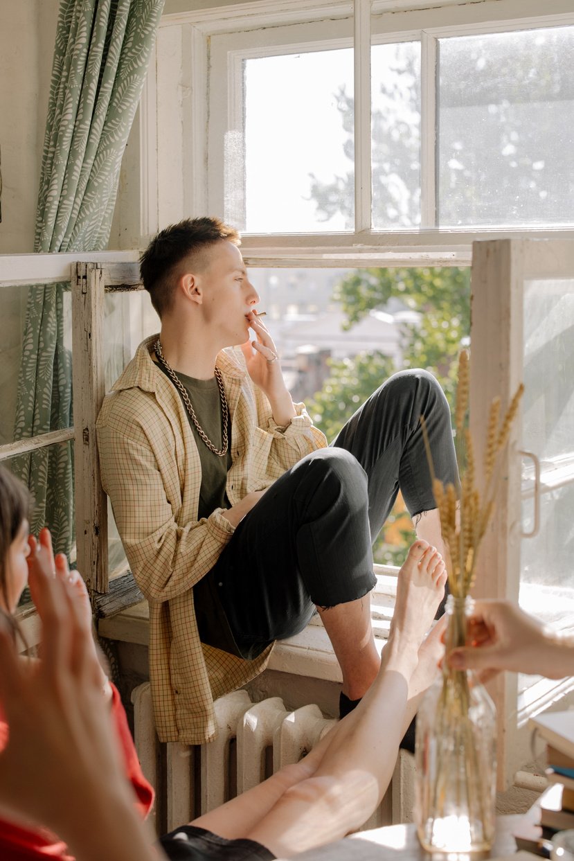 Woman in Gray Cardigan Sitting Beside Woman in Beige Cardigan