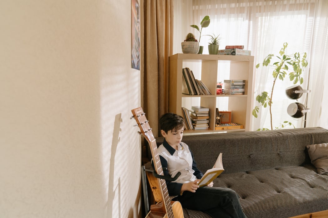 Man in White Shirt Playing Guitar